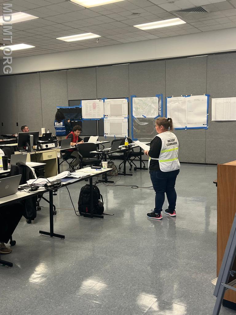 Blue team IC Katie Hadin addresses her staff.