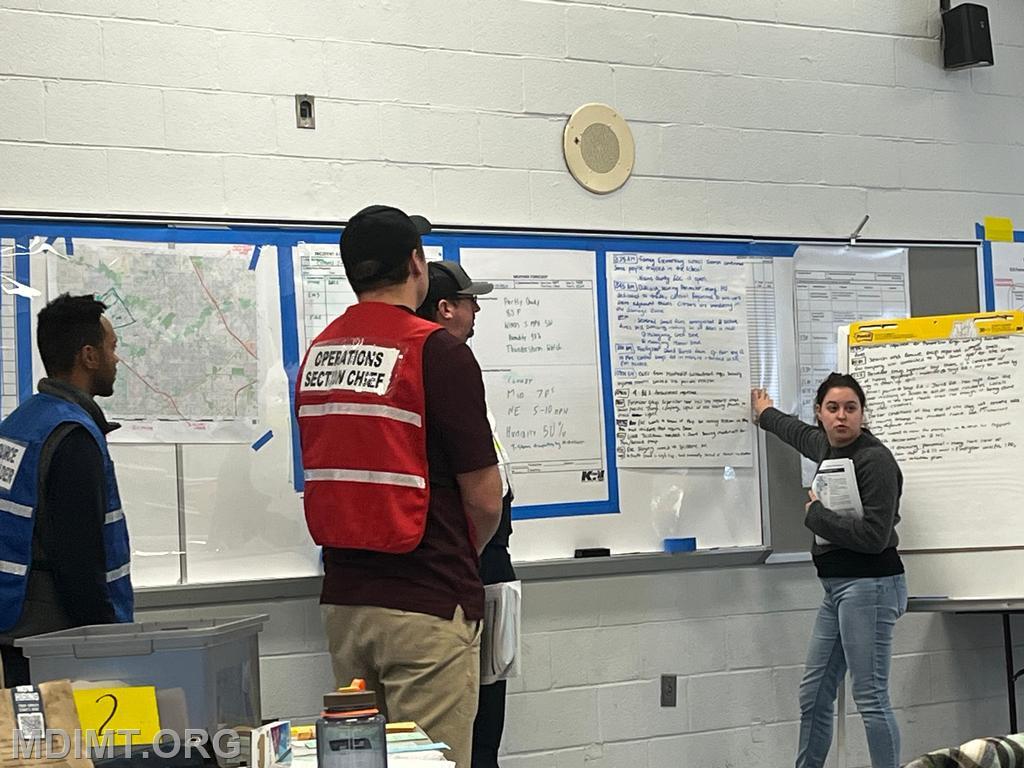 Blue Team DOSC Taylor Munir updates the Team on current operations.