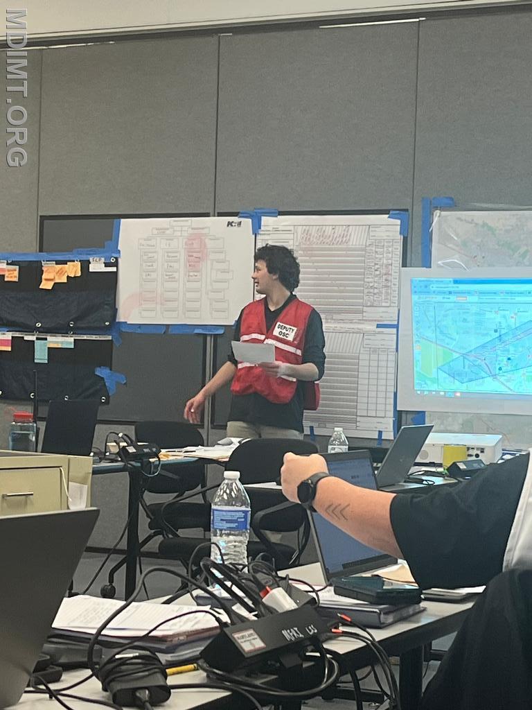 Blue Team DOSC Pat Kramer provides updates as the Tactics Meeting begins.