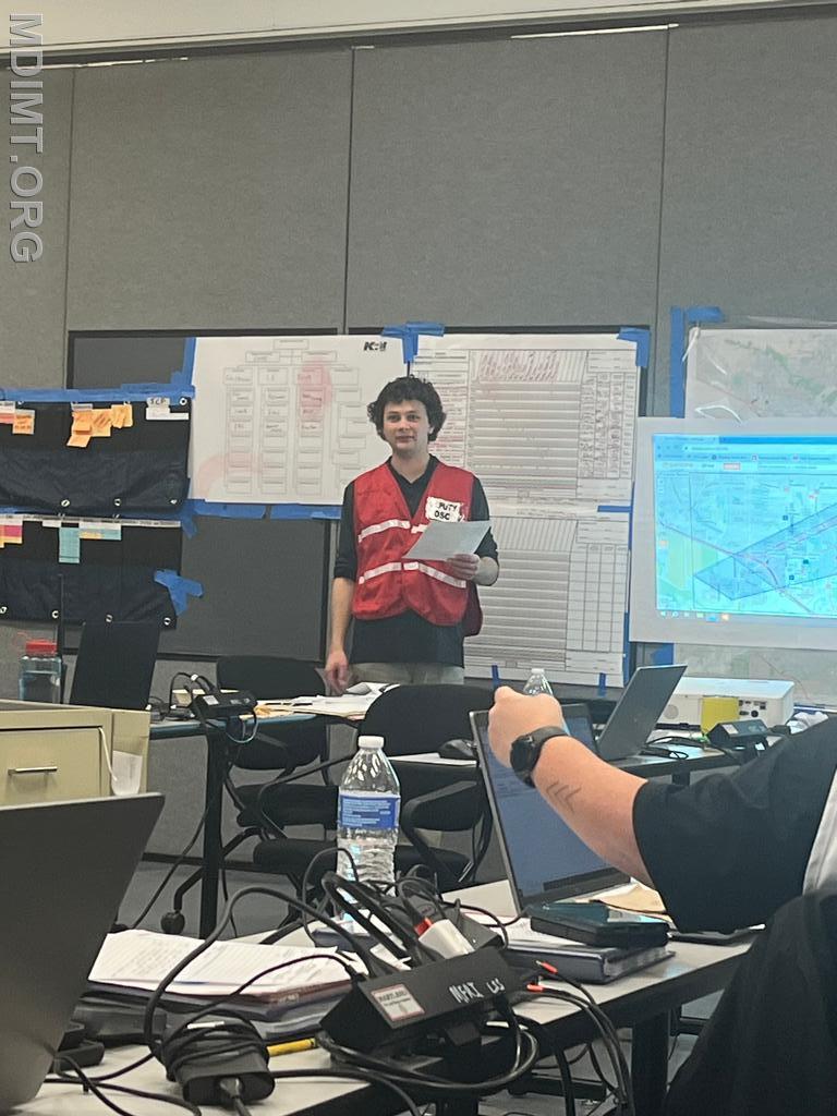 Blue Deputy Team DOSC Pat Kramer provides updates as the Tactics Meeting begins.