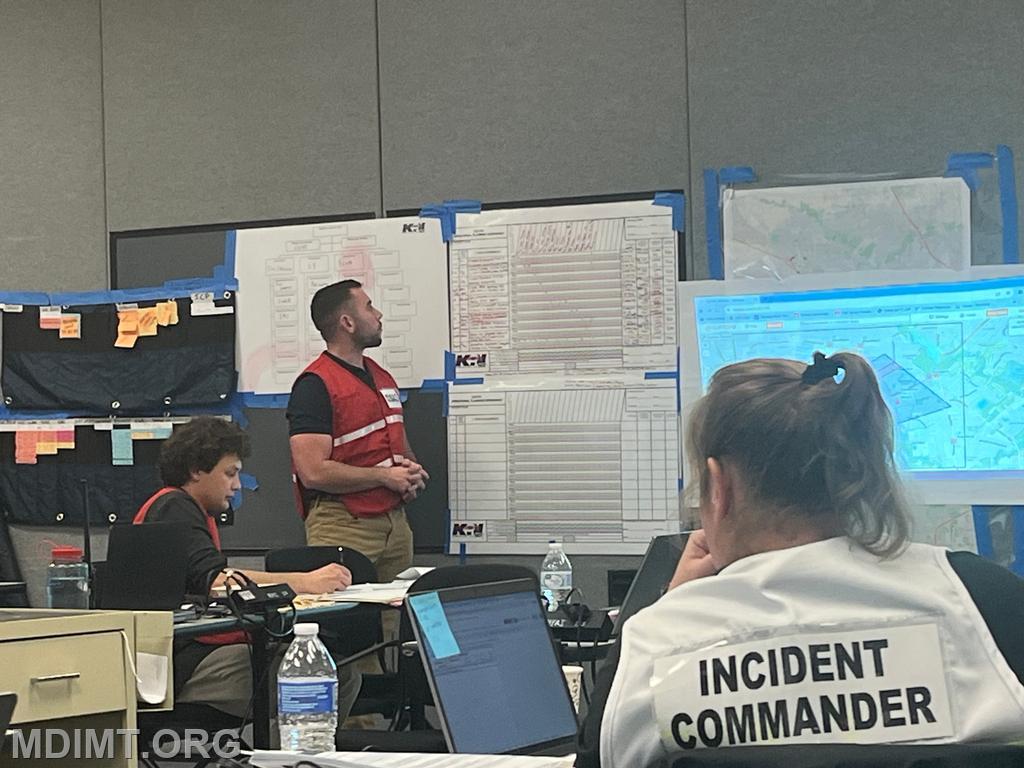 Blue Team OPSC Max Cannon present his plan to Blue IC Katie Hardin