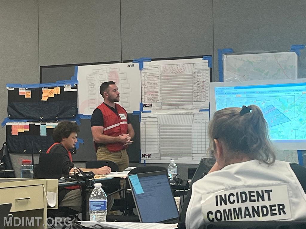 Blue Team OPSC Max Cannon present his plan to Blue IC Katie Hardin