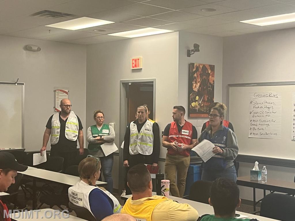 Blue Team PSC Lisa Hegwood leads OPS Brief