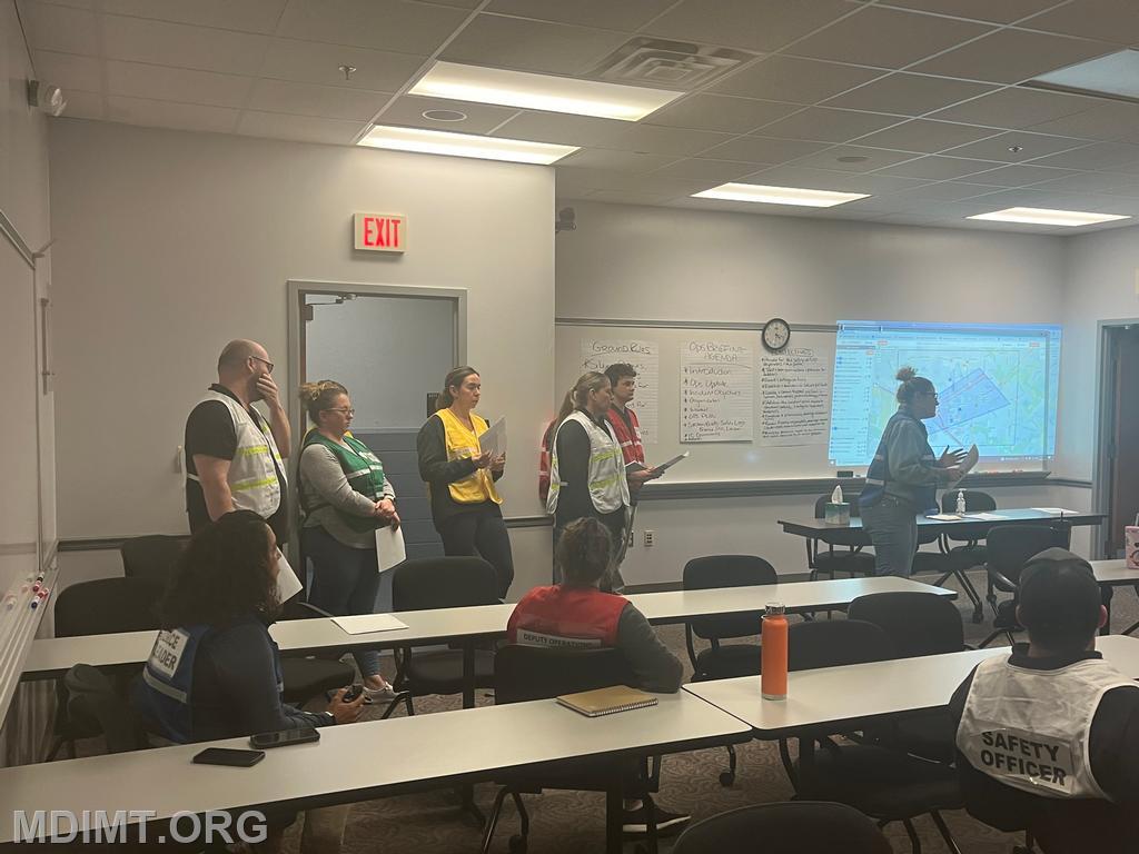 Blue Team PSC Lisa Hegwood leads OPS Brief